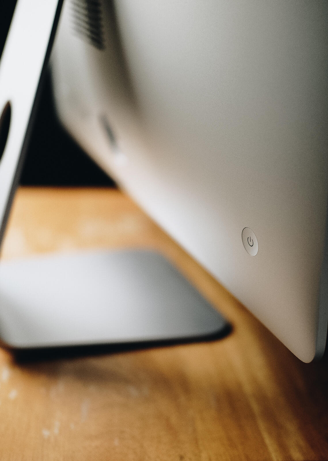 a closeup of the power button on an iMac computer