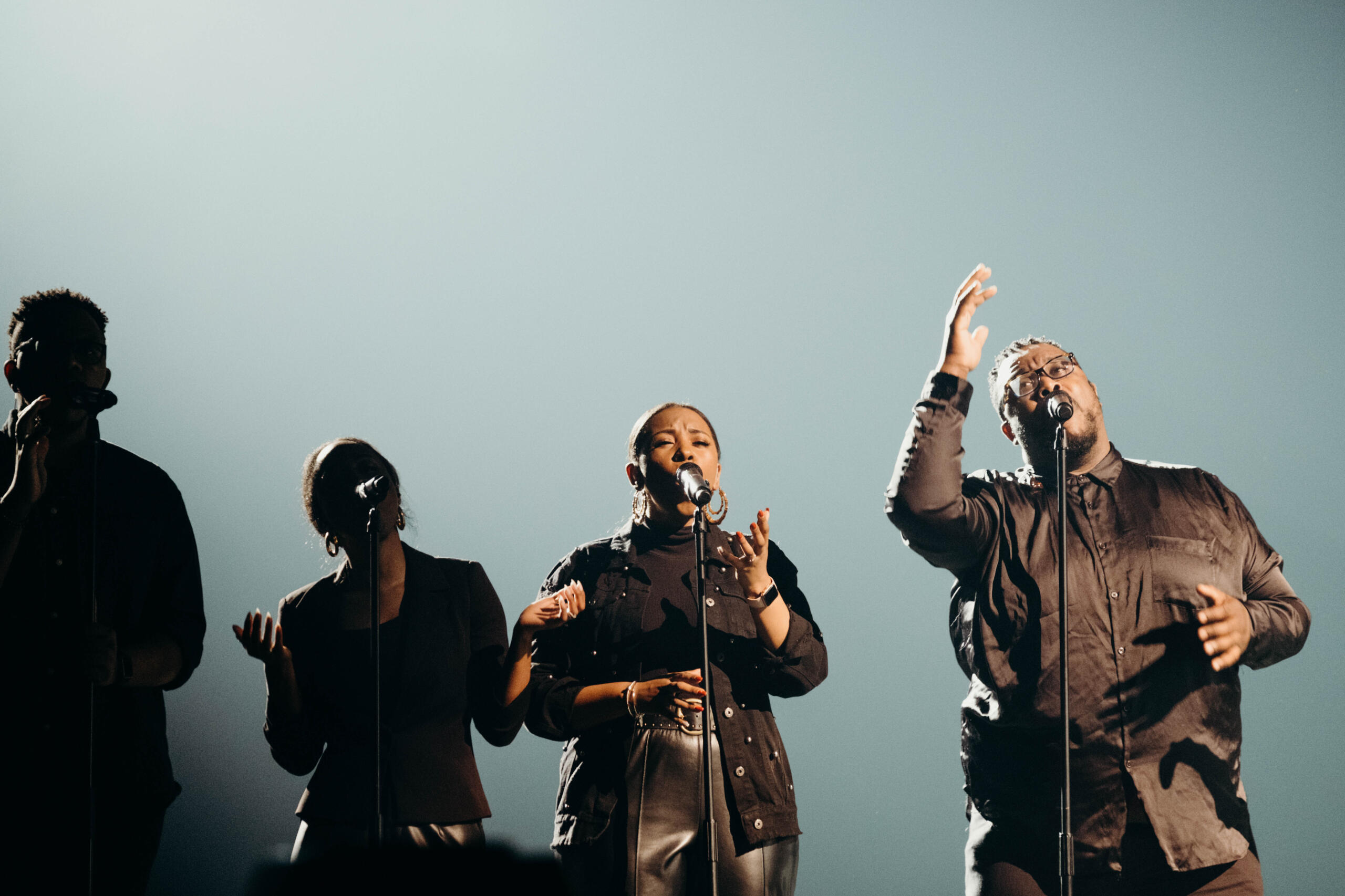 backup singers on stage during a concert
