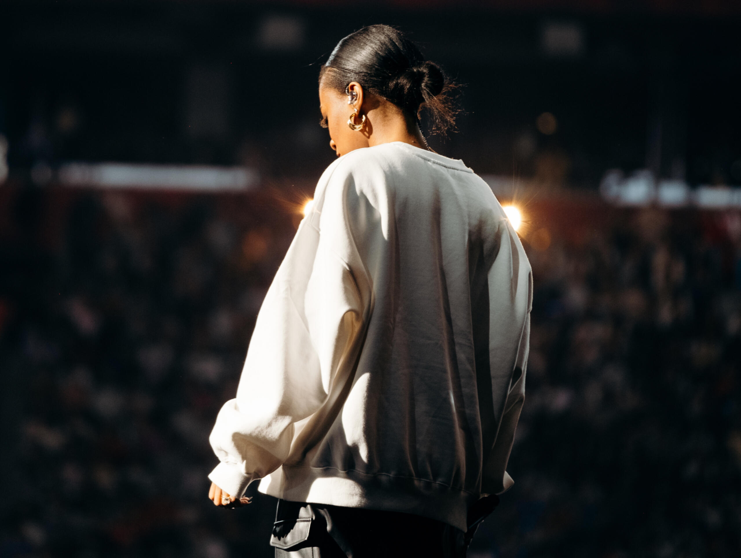 indoor concert a woman on stage in an arena