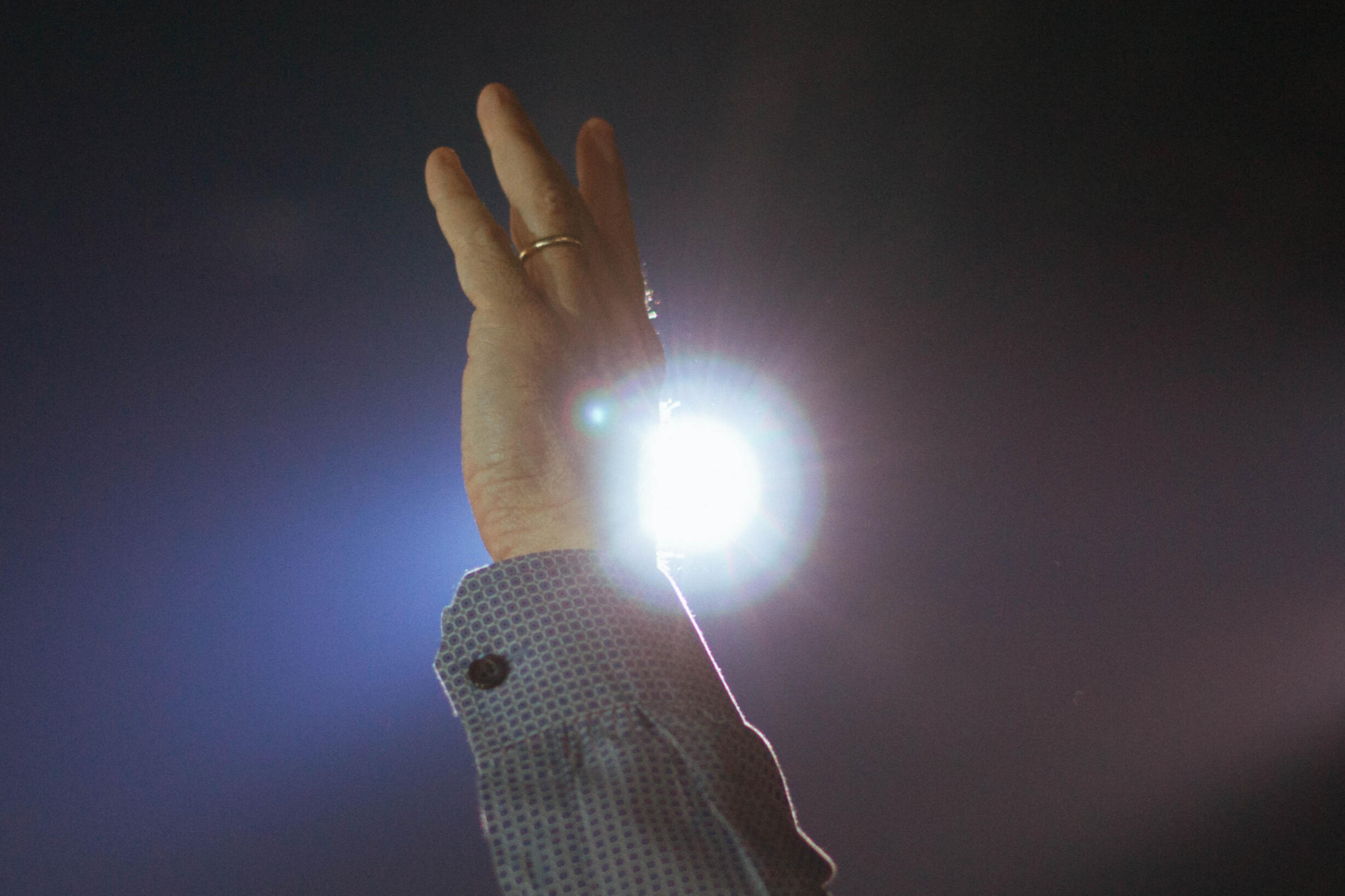 a man's hand lifted in the air