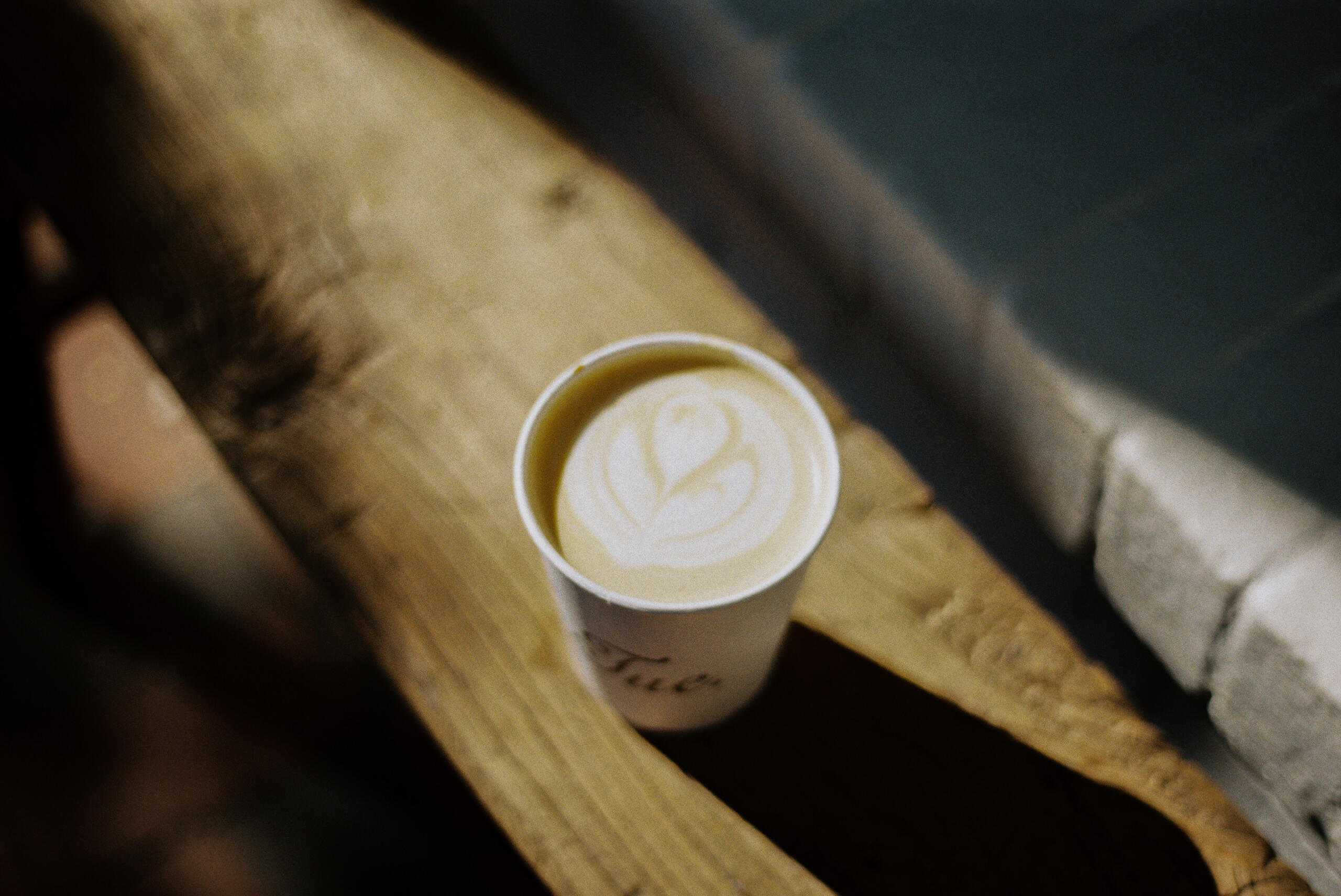 coffee a cup of coffee on a bench