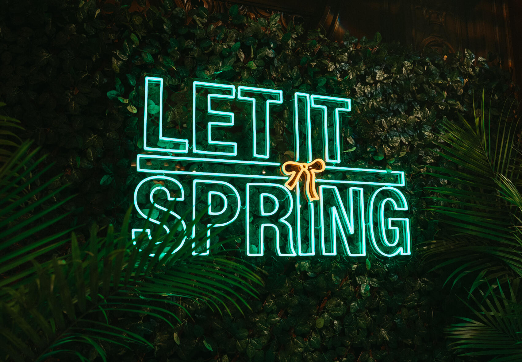 a neon sign that says let it spring