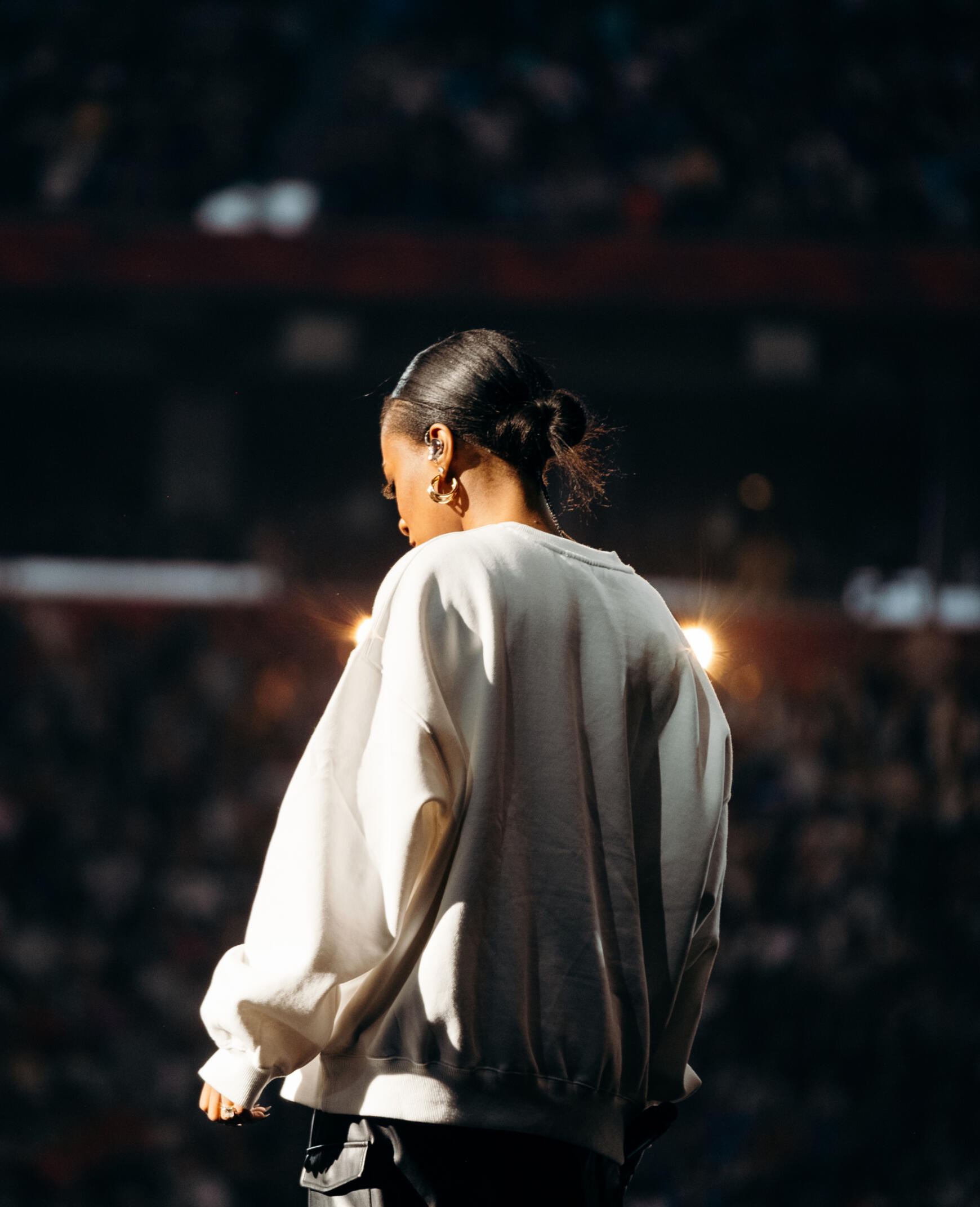 indoor concert a woman on stage in an arena